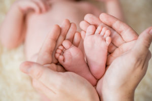hands holding baby-feet